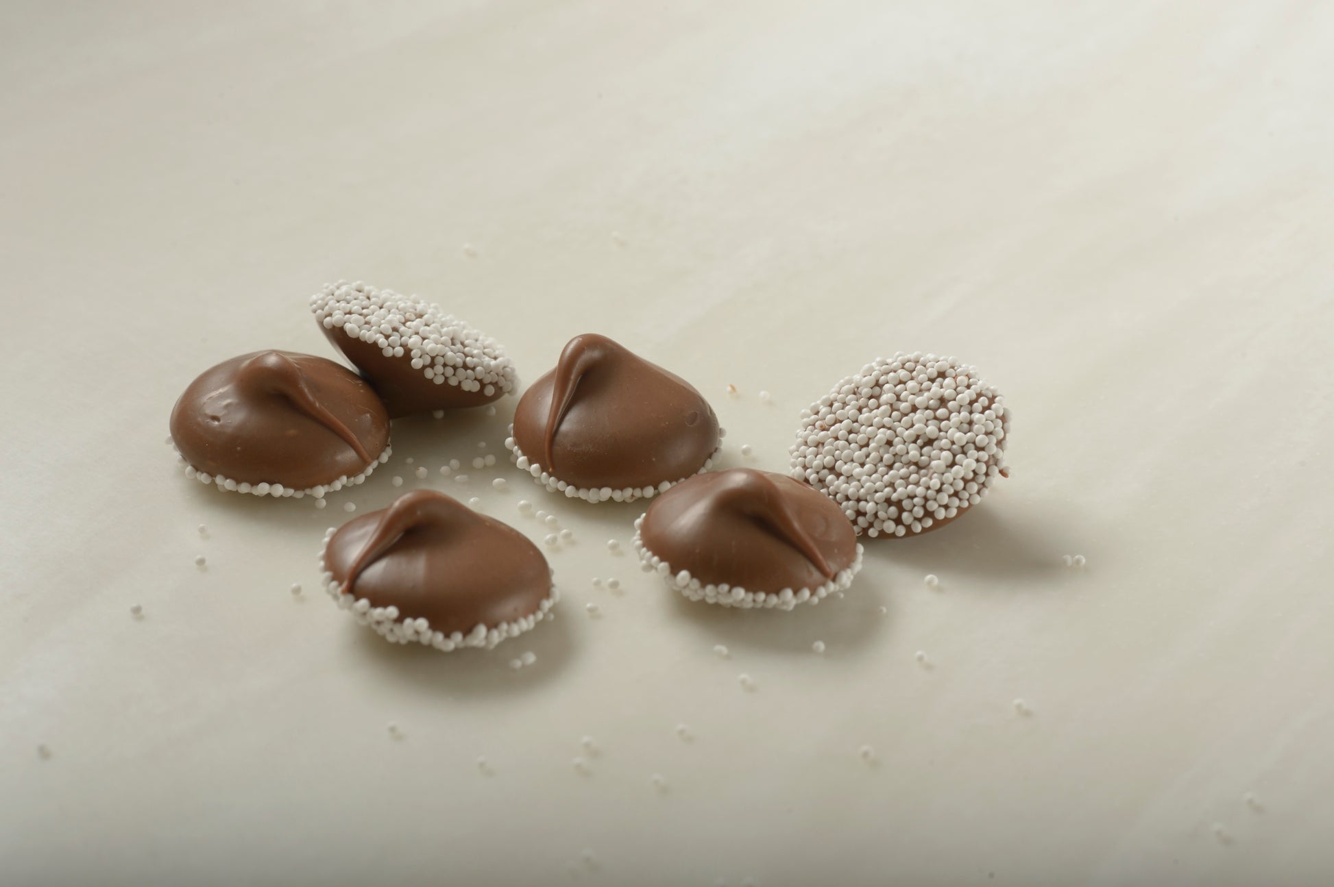 Milk Chocolate Nonpareils with White Seeds | Mueller Chocolate Co.