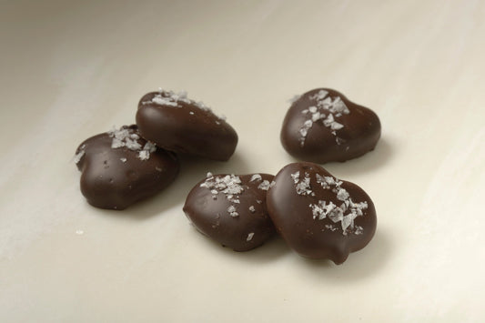 Mini pretzels in caramel and dark chocolate with sea salt topping - a sweet and salty delight from Mueller Chocolate Co.