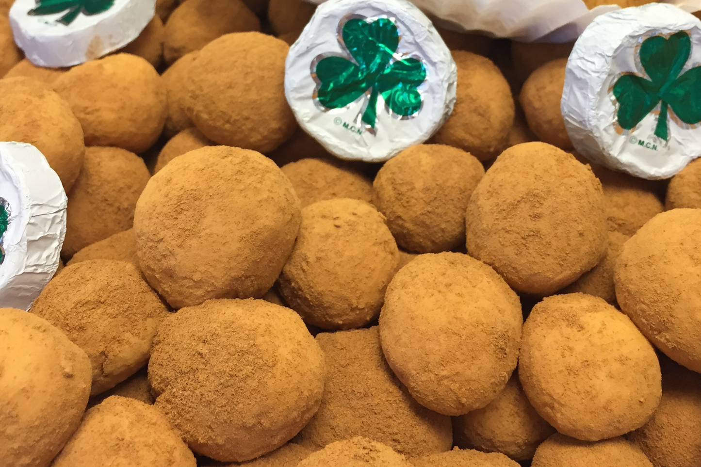 Irish Potatoes: A heavenly blend of coconut cream, delicately rolled in aromatic cinnamon for a delightful taste of tradition from Mueller Chocolate Co.
