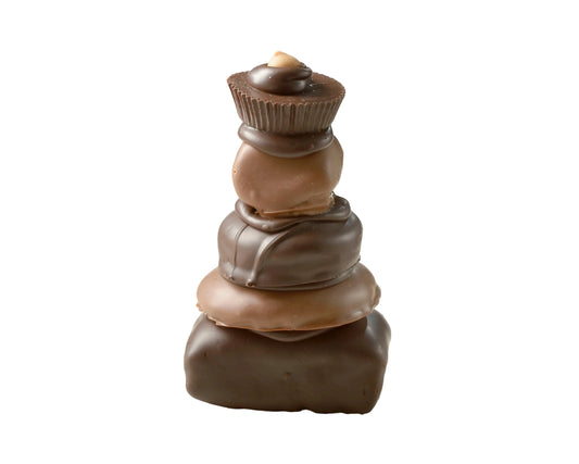 Decadent Chocolate Tower showcasing gourmet delights - Oreos, Rice Crispy Treats, marshmallows, Peanut Butter Cups, and Chocolate Chip Cookies, all dipped in rich chocolate. A delicious gourmet chocolate experience praised by Marc Summers and featured on the Food Network.