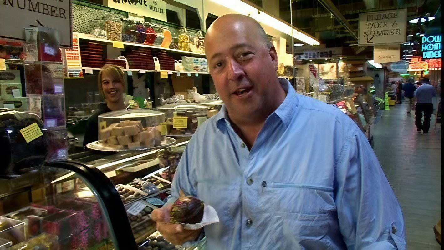 Andrew Zimmern from the Travel Channe presenting a chocolate covered onion At Muellers Chocolate in the Historic Reading Terminal Market