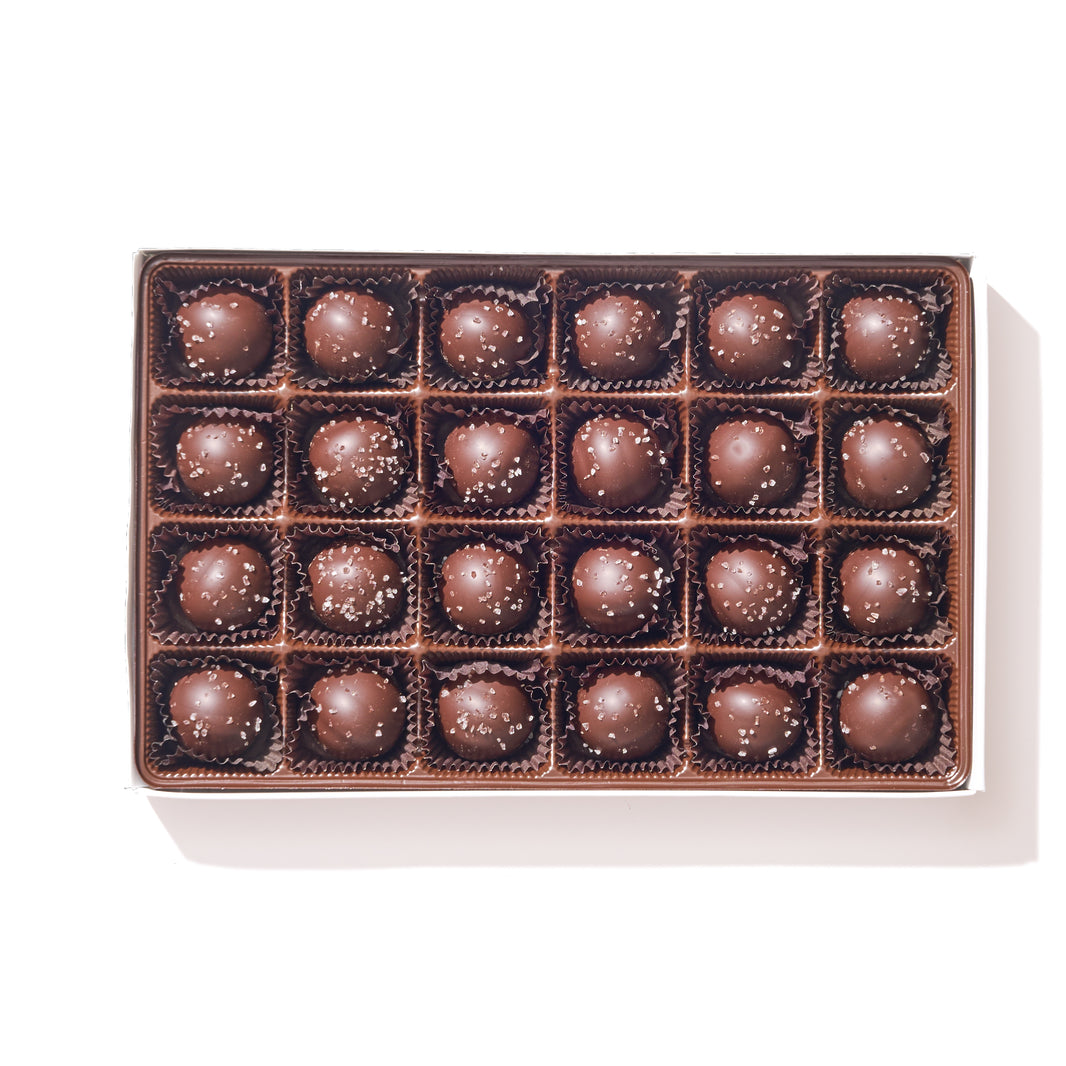 Dark Chocolate Sea Salt Caramel Truffle Gift Box – 24 sea salt caramel–flavored ganache truffles in elegant dark chocolate packaging.