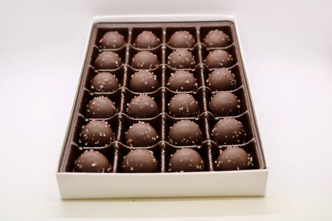 Dark Chocolate Sea Salt Caramel Truffles with caramel-flavored ganache and sea salt, coated in dark chocolate.