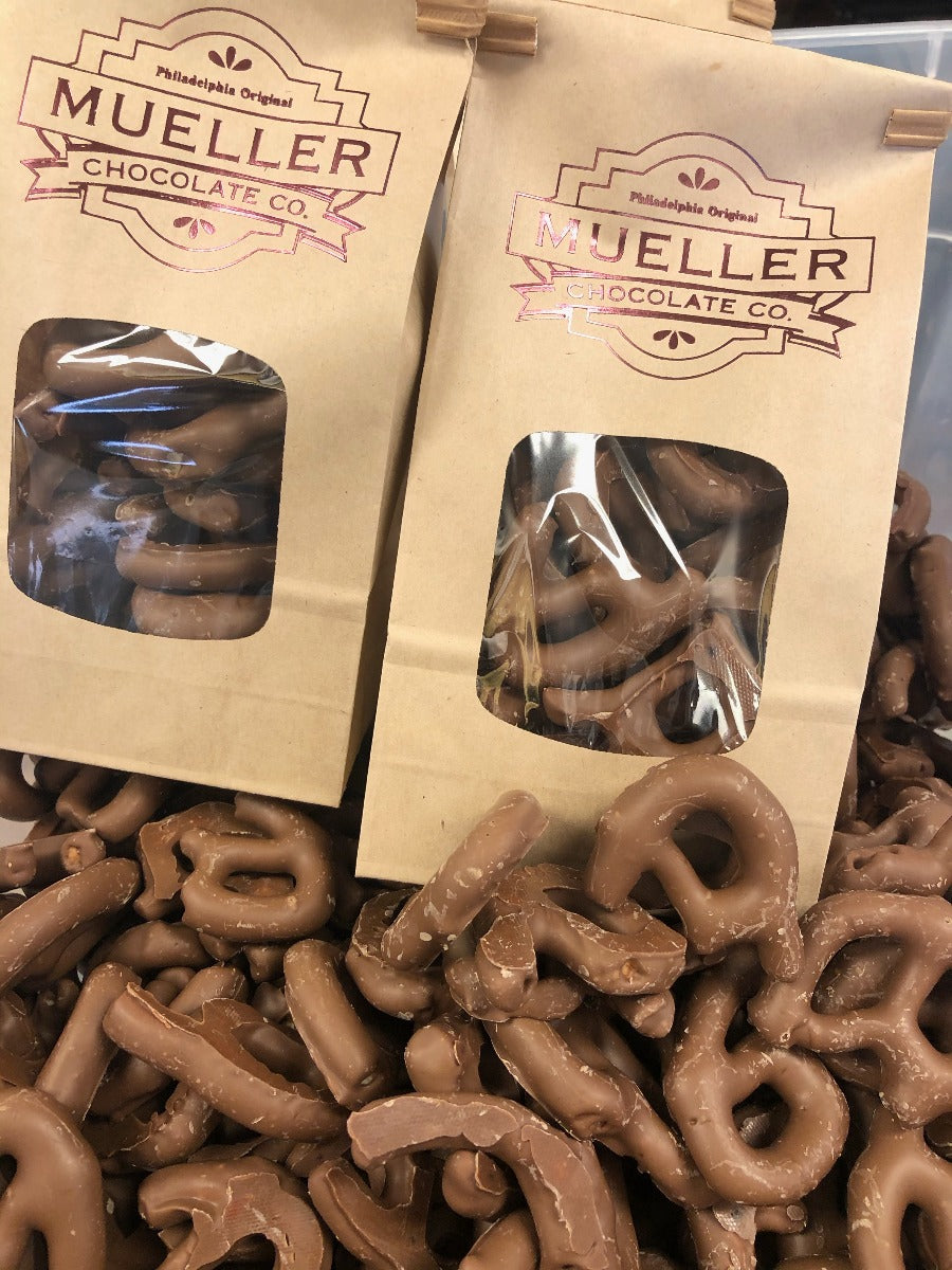 Bag of Broken Pretzel Pieces with visible Mueller Chocolate Co bags